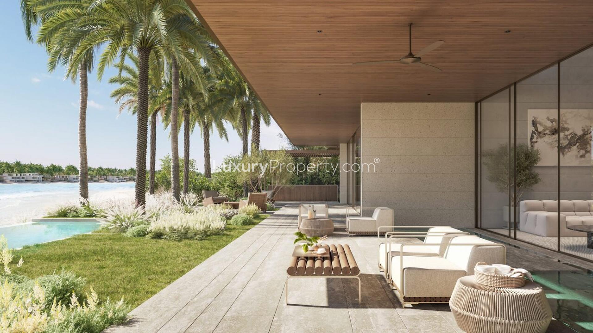 Luxurious living room with waterfront view in Palm Jebel Ali beach villa for sale