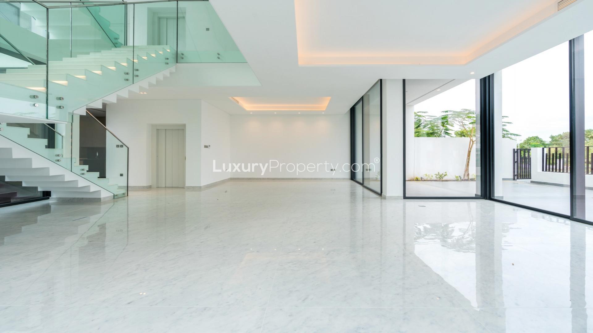 Contemporary Al Barari villa with private pool, lush garden, and modern architecture for sale