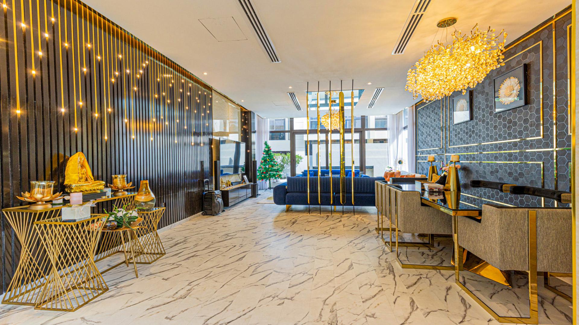 Luxurious living room in Damac Hills villa with elegant decor and modern furnishings