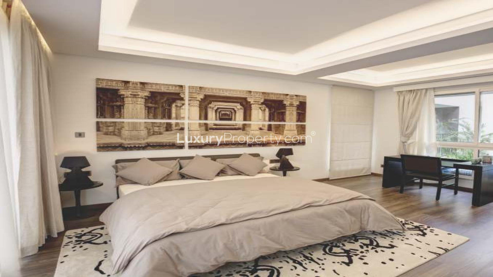 Luxurious master bedroom in Sobha Phase 1 villa, featuring elegant decor and spacious layout