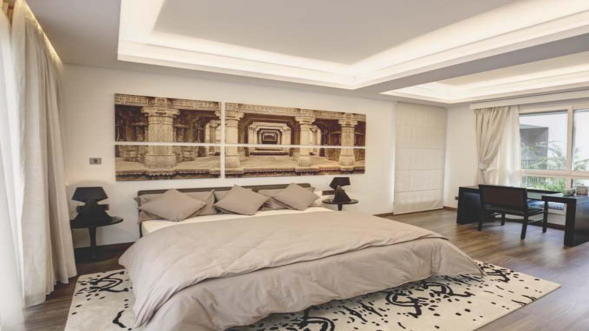 Luxurious master bedroom in Sobha Phase 1 villa, featuring elegant decor and spacious layout
