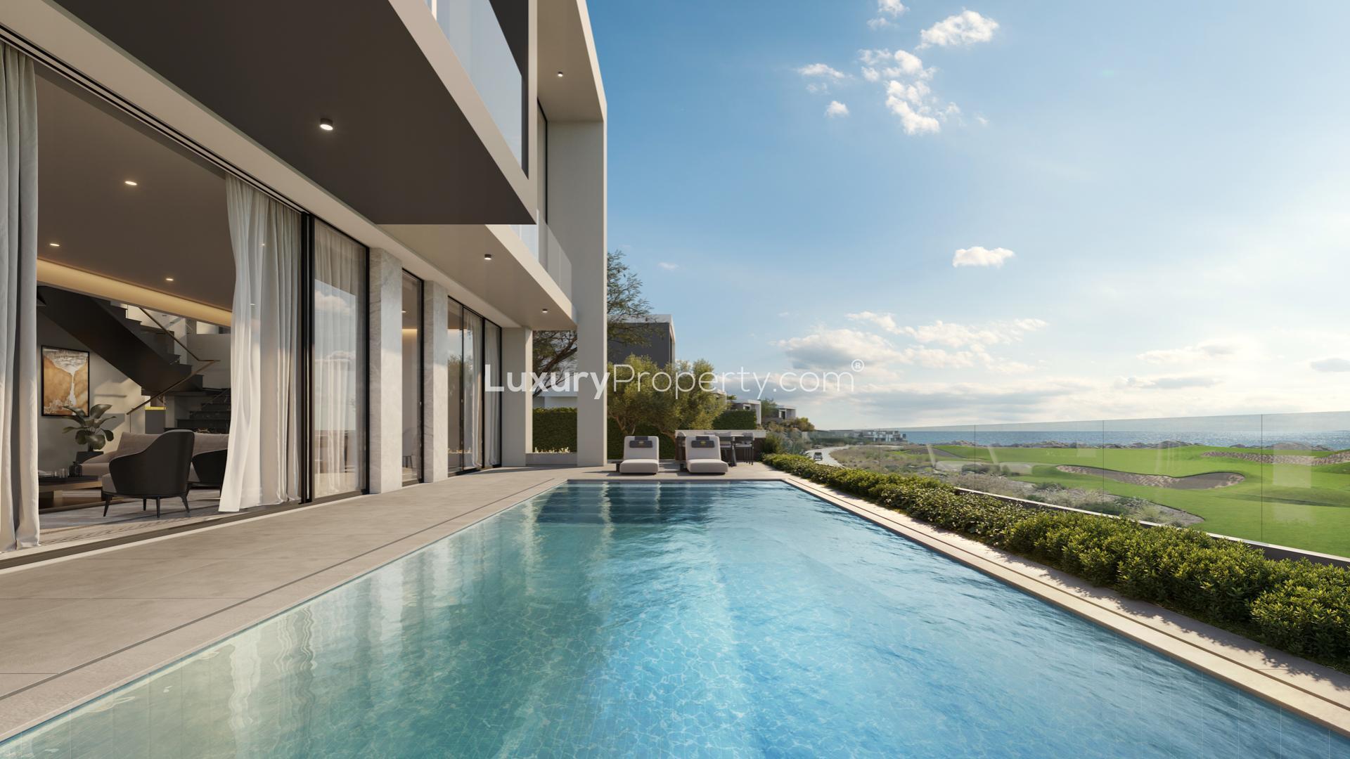 Luxurious dining room in 5-bed Trump Golf Villa, Muscat, overlooking golf course and pool