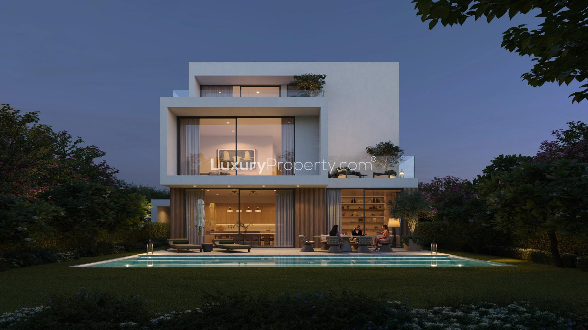 "Modern 5-bedroom luxury villa exterior in Grand Polo Club, Dubai Investment Park, for sale.",Luxurious 5-bedroom villa with pool at Grand Polo Club, Dubai Investment Park, for sale