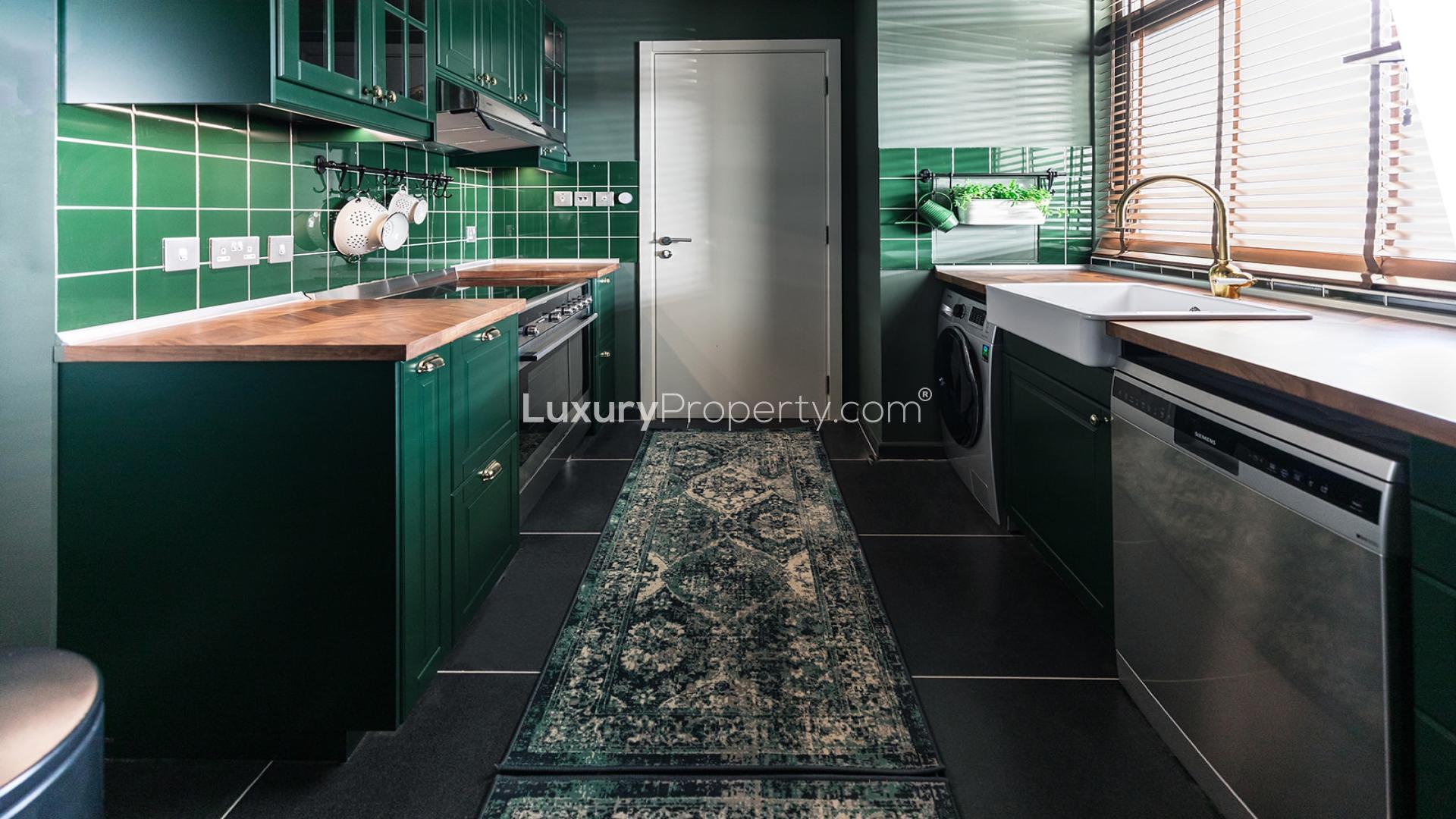 Modern living room and dining area in Damac Hills 2 Aurum Villas, spacious and elegant