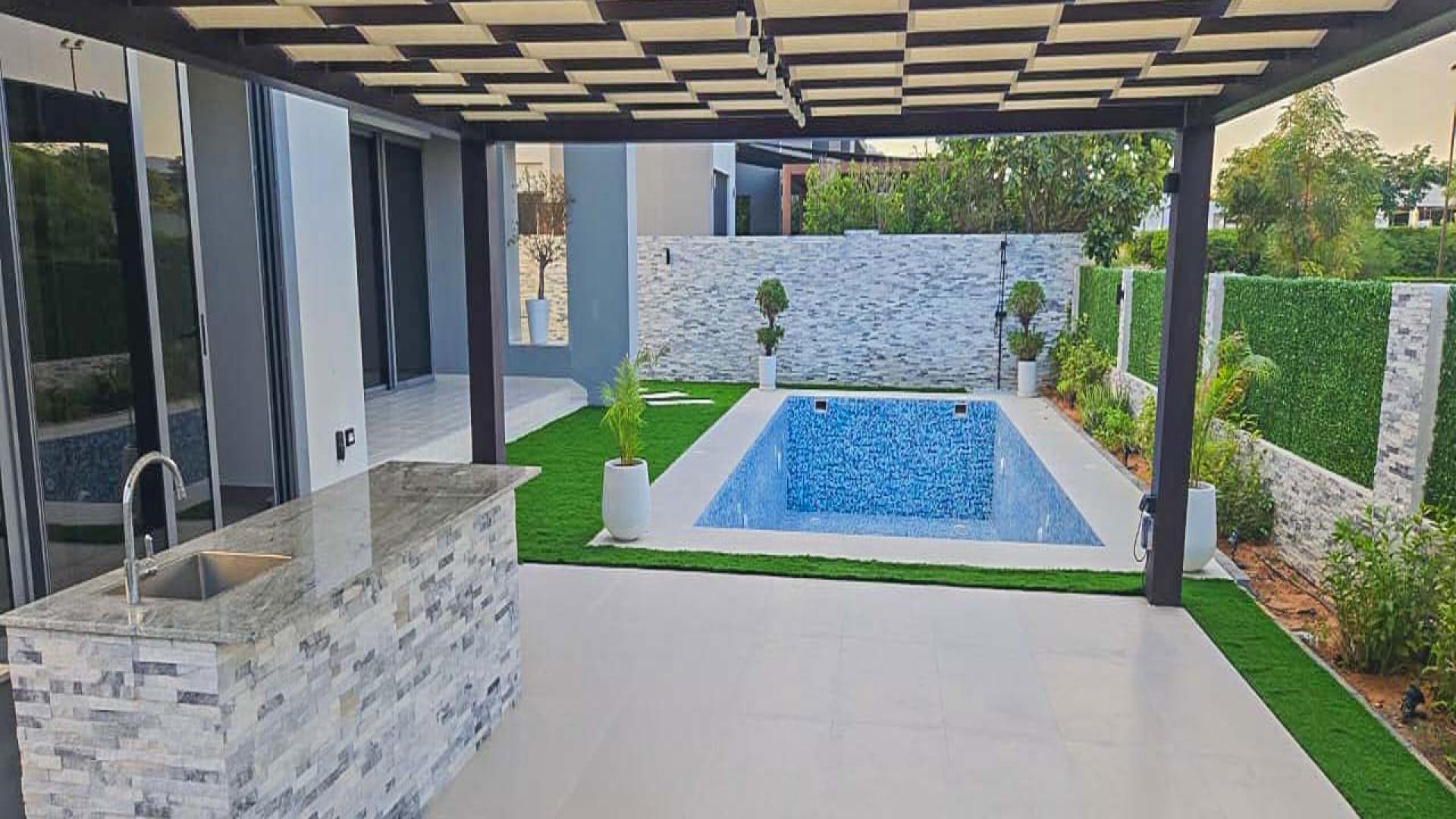 "Luxury E5 Villa entrance with modern design, Sidra Villas II, Dubai Hills Estate.",Private garden view of luxury villa, Sidra Villas II, Dubai Hills Estate