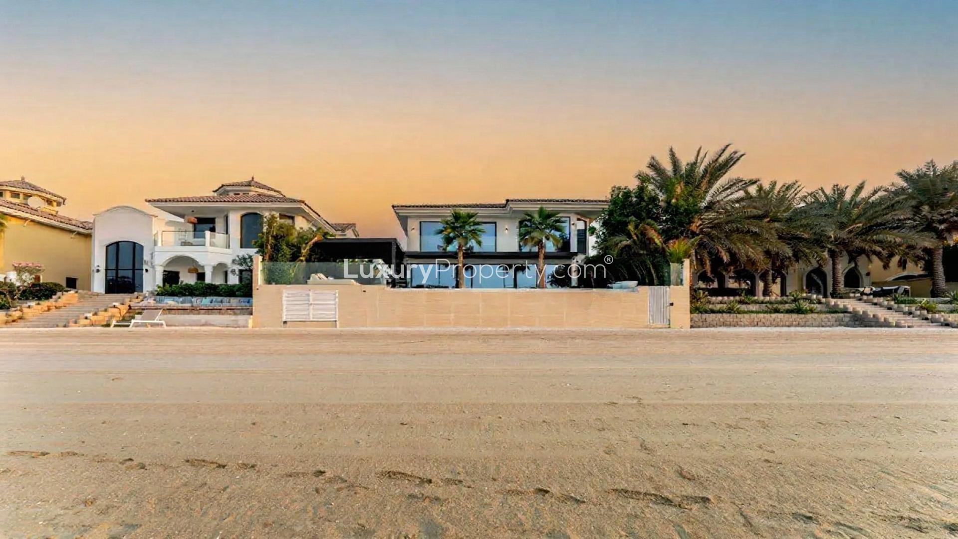 Luxurious Palm Jumeirah villa with pool, spacious patio, and lush garden for sale