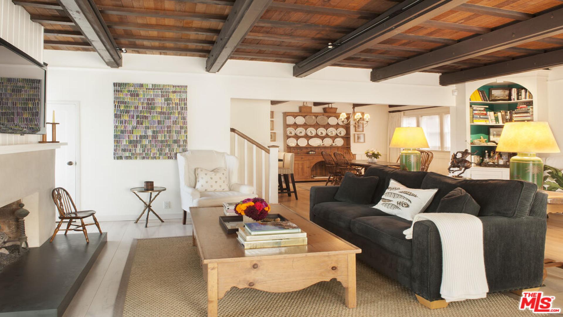 Cozy living room with fireplace in five-bedroom Craftsman villa, Venice, California