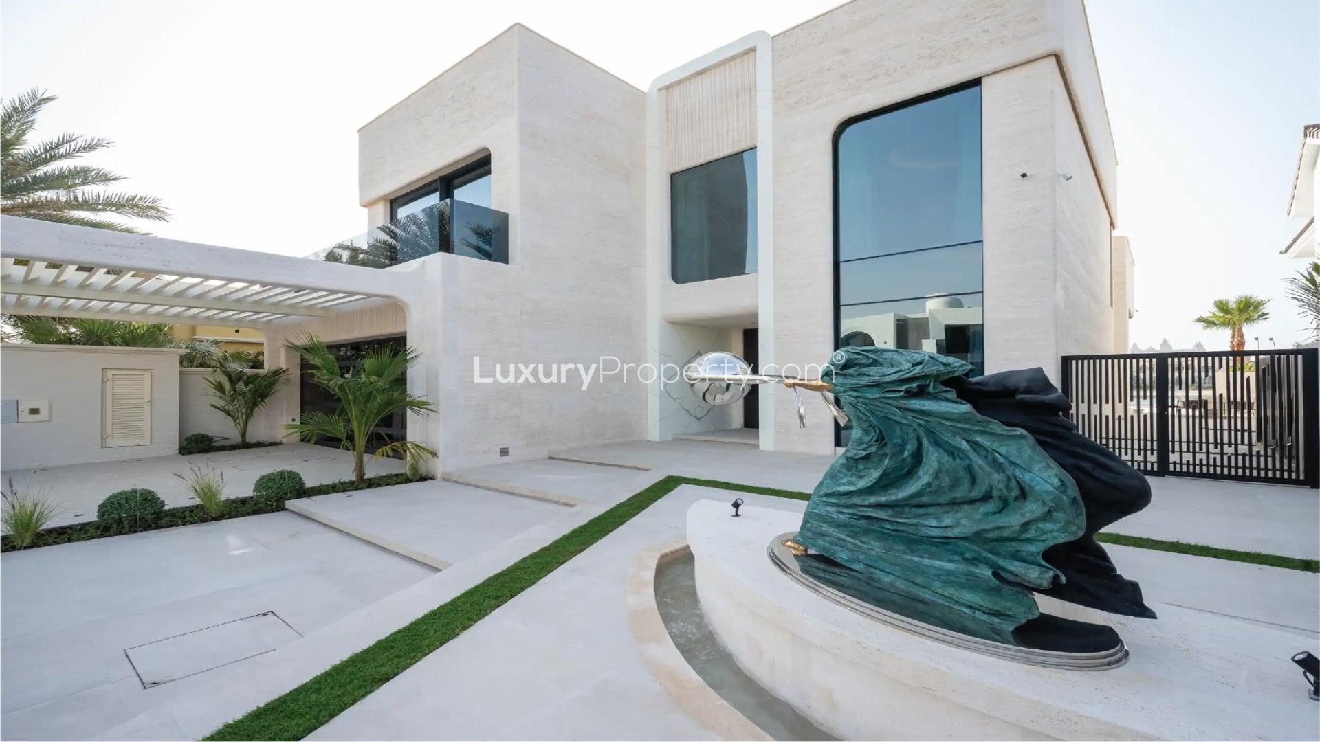 Luxurious dining and living area with waterfront view in Palm Jumeirah villa