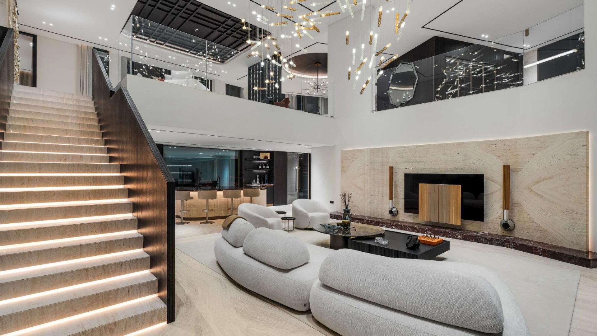 Luxury Jumeirah Islands villa with modern poolside view, palm trees, and spacious patio area