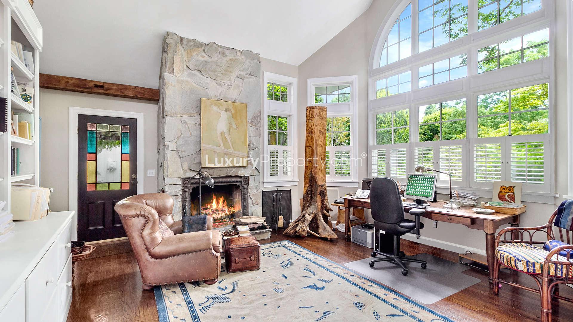 Elegant living room in five-bedroom Bridgehampton villa, featuring high ceilings and large windows