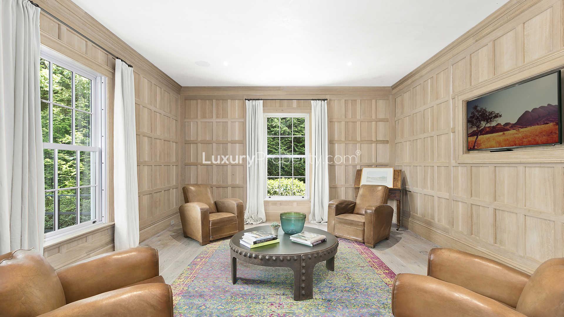 Modern classic-style living room in Sag Harbor villa, featuring elegant decor and natural light