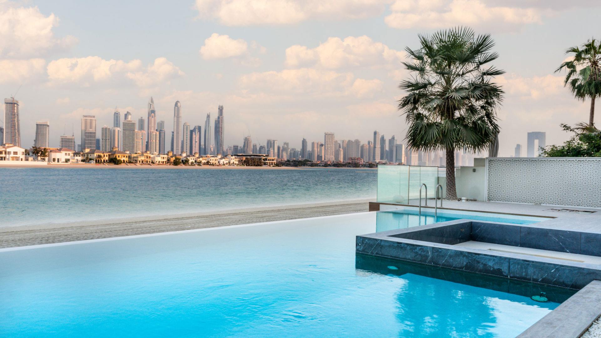 Luxurious dining area in 5-bedroom villa, Palm Jumeirah, with elegant decor and modern design