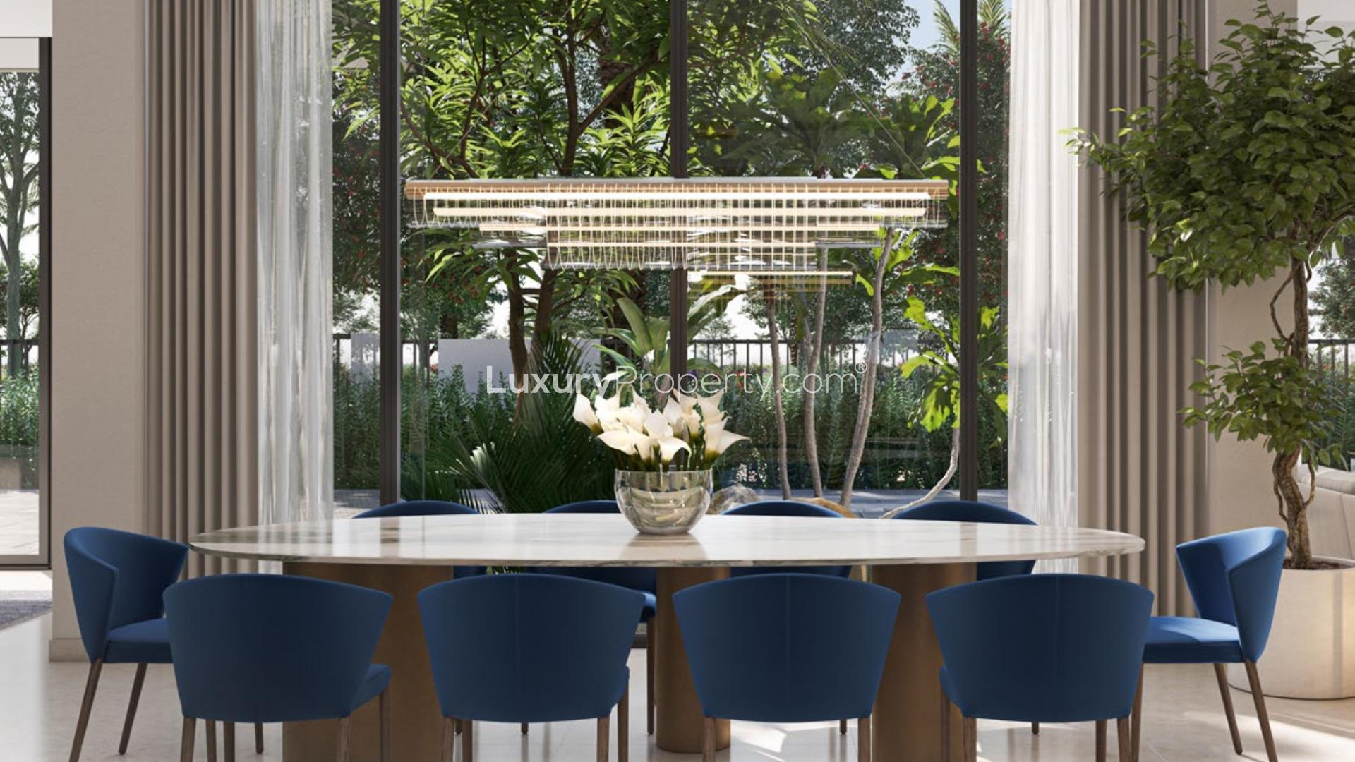 Elegant living room in luxury villa at Dubai Hills Estate, featuring modern decor and staircase