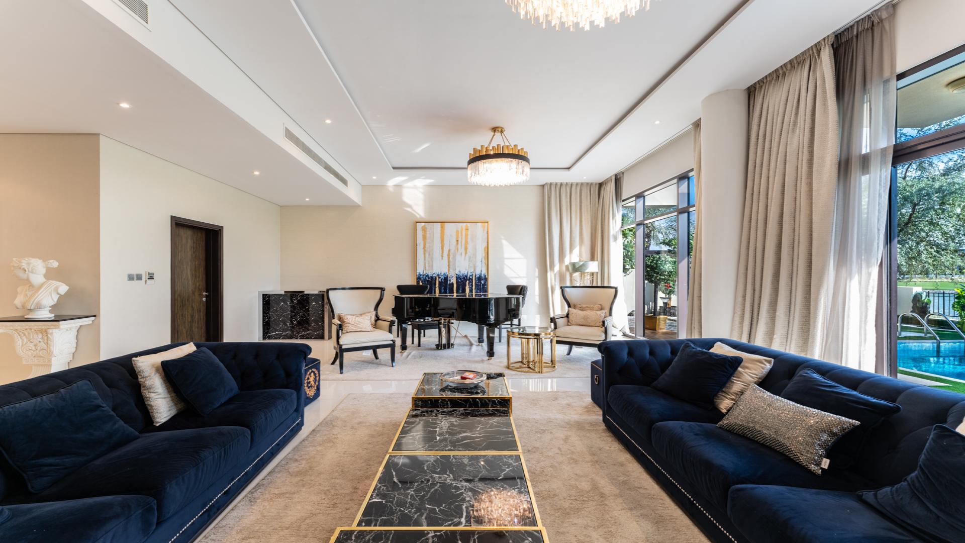 Luxurious living room in DAMAC Hills villa, featuring elegant decor and modern furnishings
