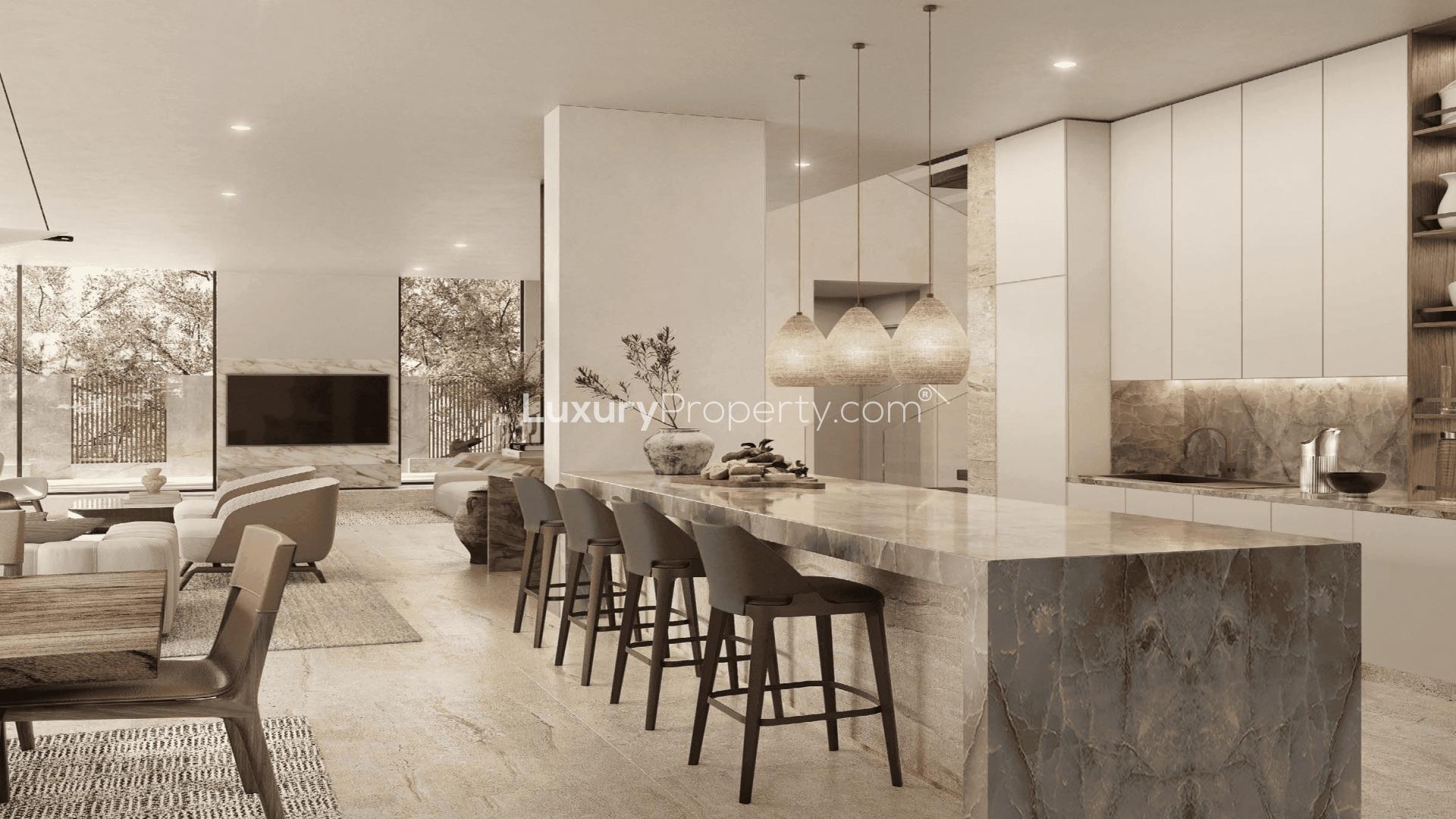 Luxury open-plan living area in Tilal Al Ghaf villa with modern decor and natural light