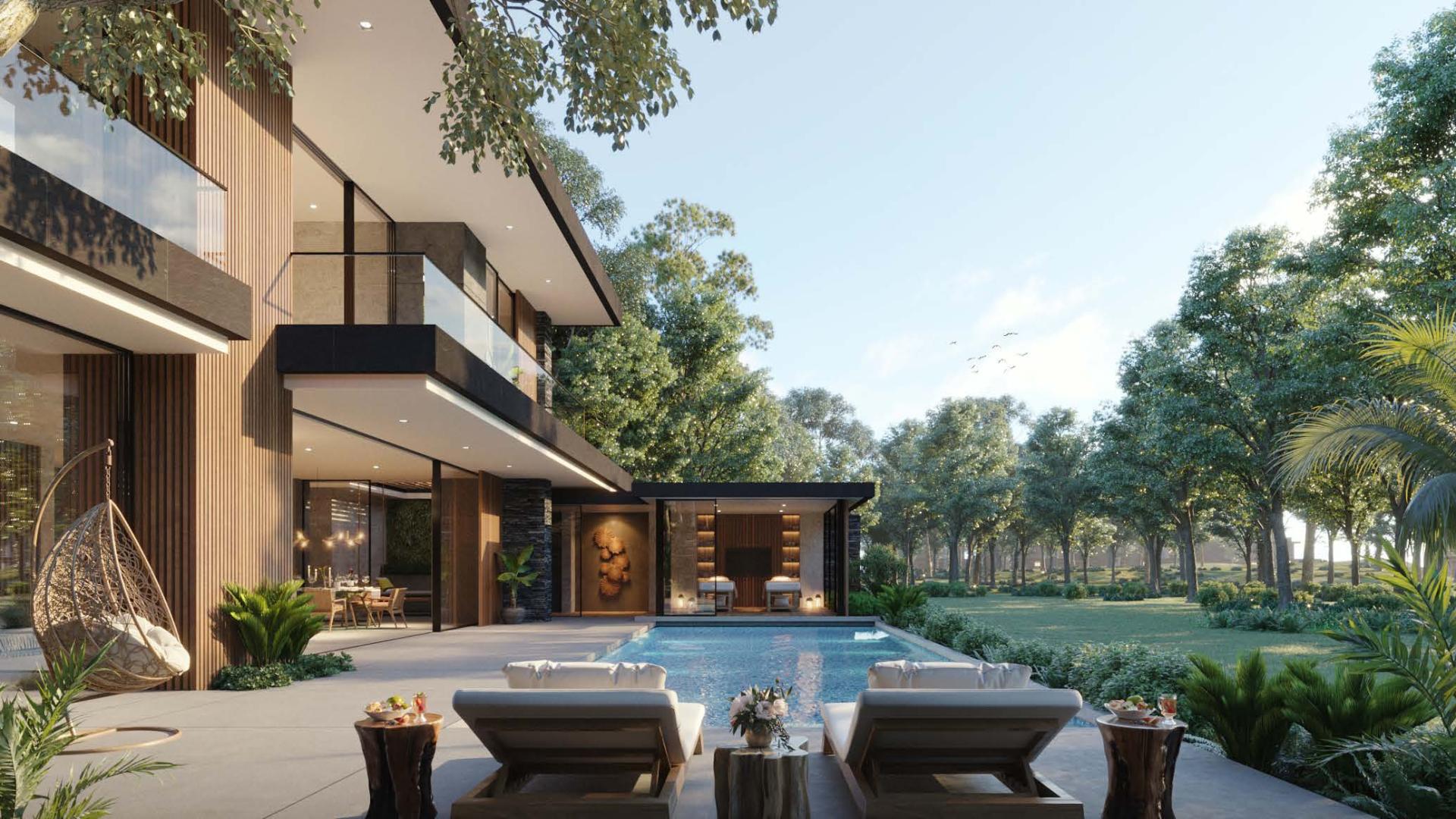 Luxury Alaya Beach Villa poolside view at sunset in Tilal Al Ghaf community