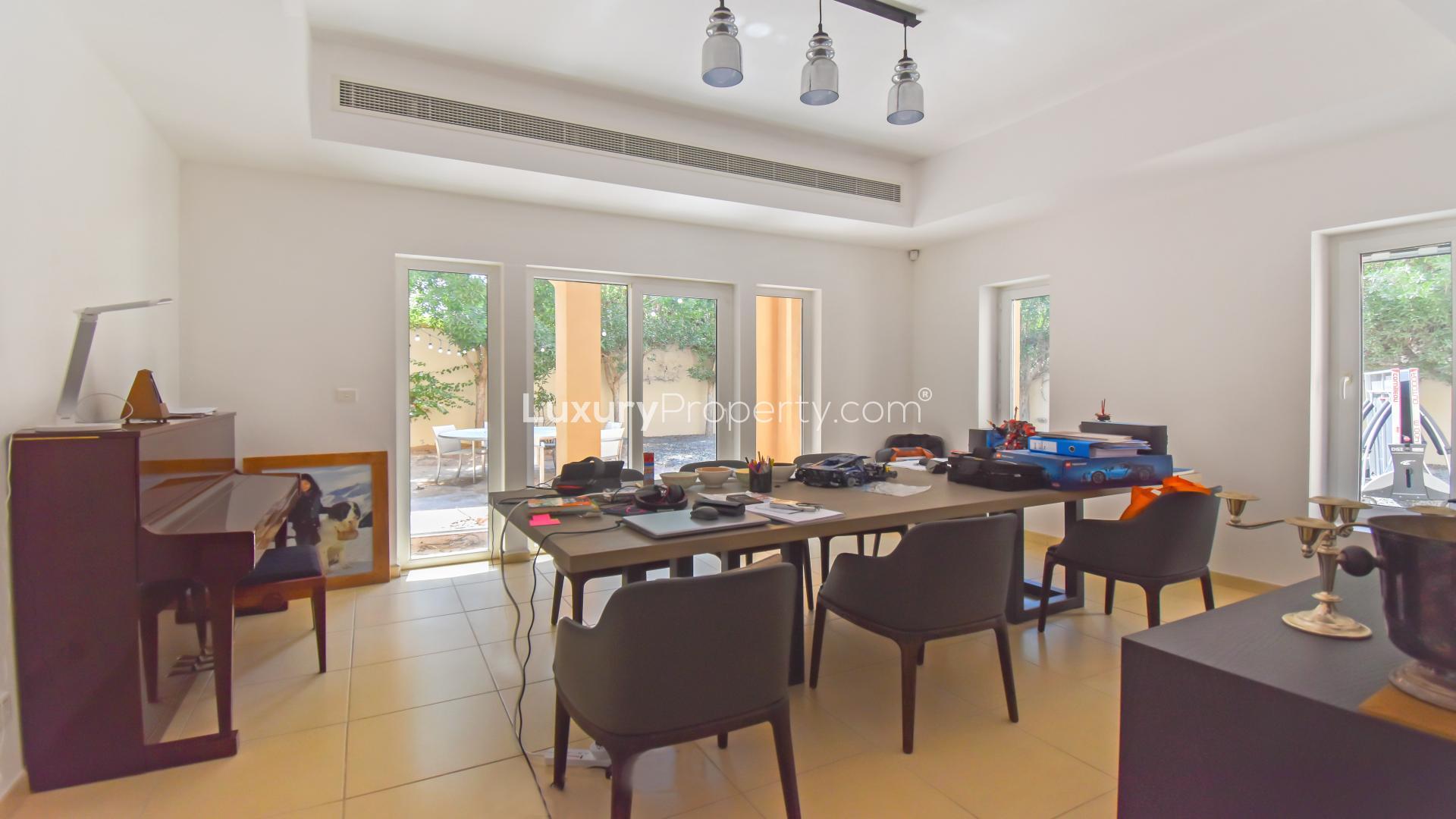 Living room in 5-bedroom villa, Al Mahra, Arabian Ranches, spacious seating and decor