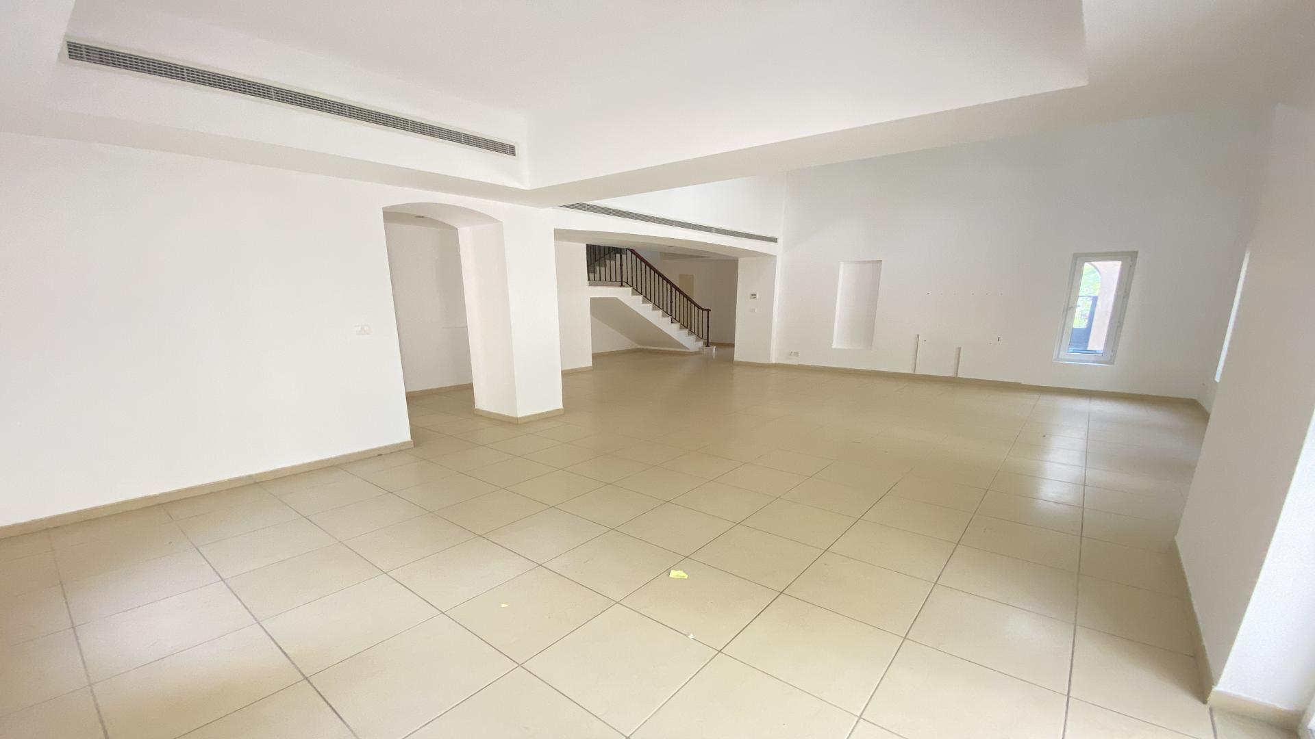 Spacious villa living room with high ceiling in Arabian Ranches, Al Mahra community