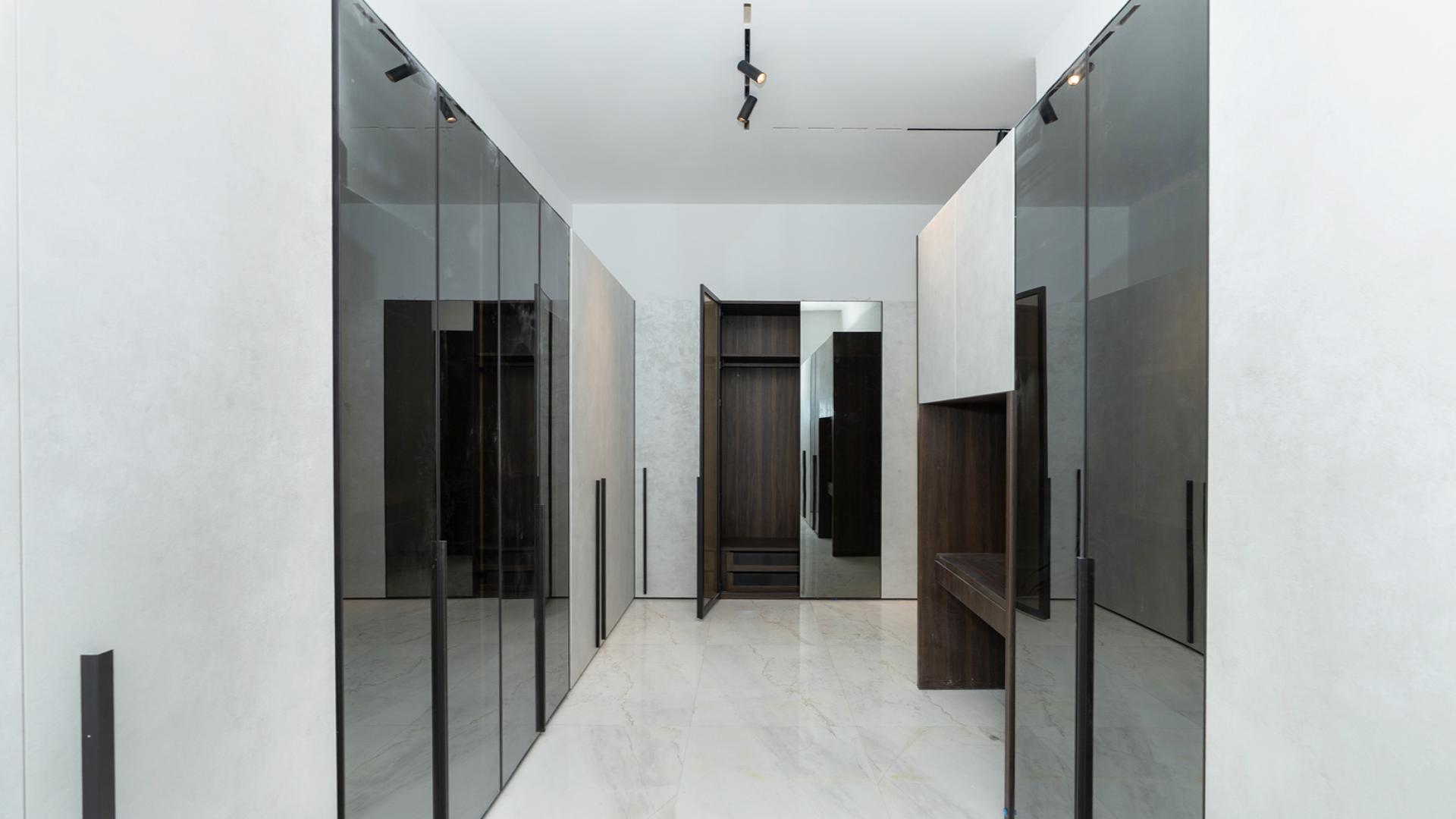 Luxurious Al Wasl villa interior with grand piano, marble flooring, and modern staircase