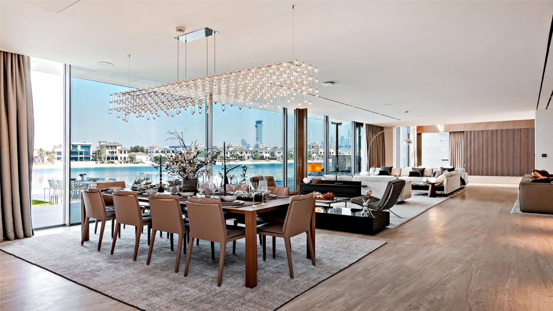 Exquisite Palm Jumeirah Signature Villa with modern design, beachfront view, and lush landscaping