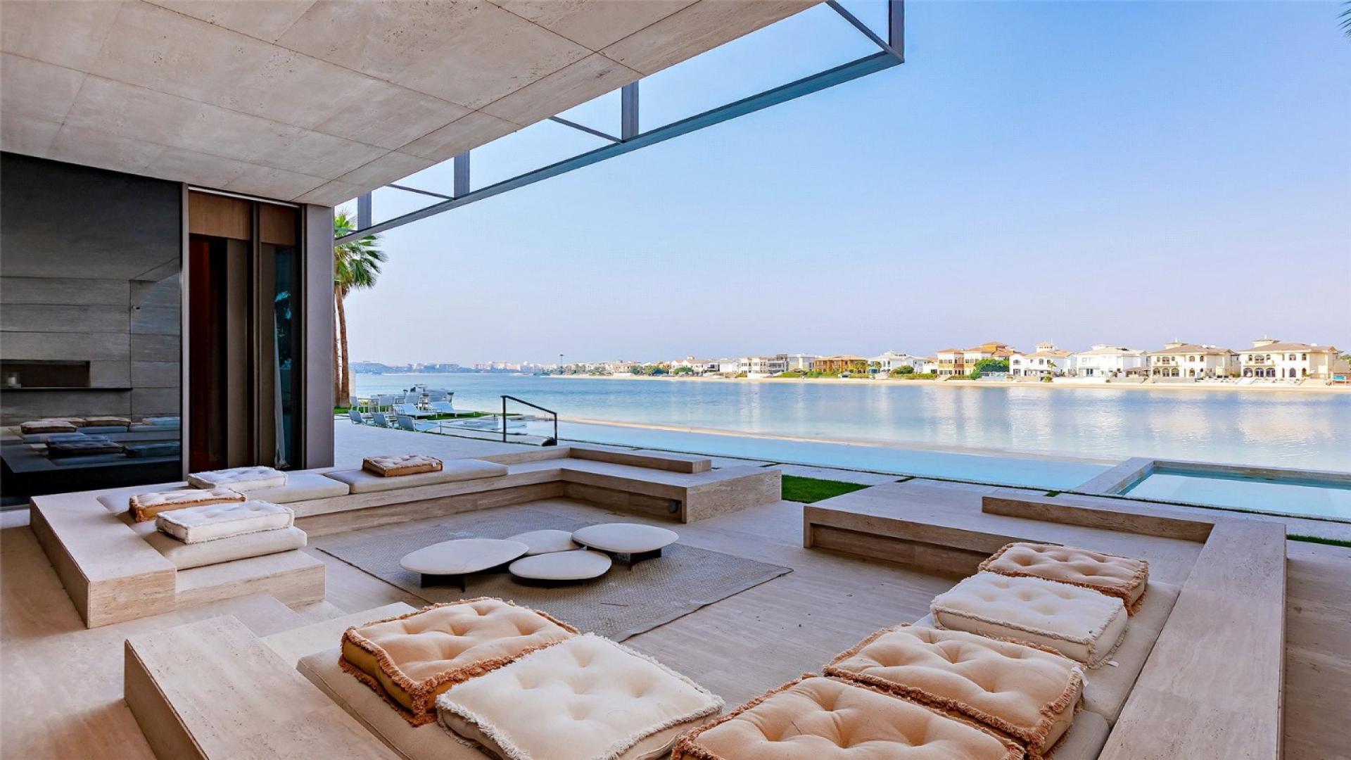 Luxurious open-plan living area with waterfront views, Palm Jumeirah Signature Villa for sale