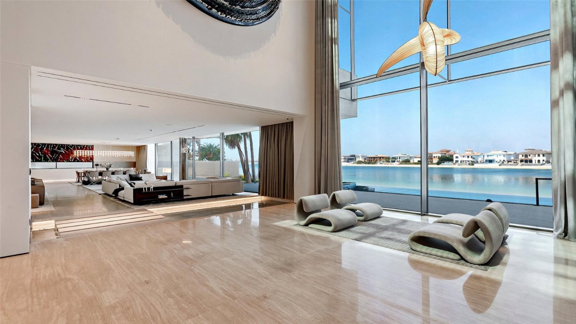 Luxurious dining and living area in Palm Jumeirah Signature Villa with waterfront views