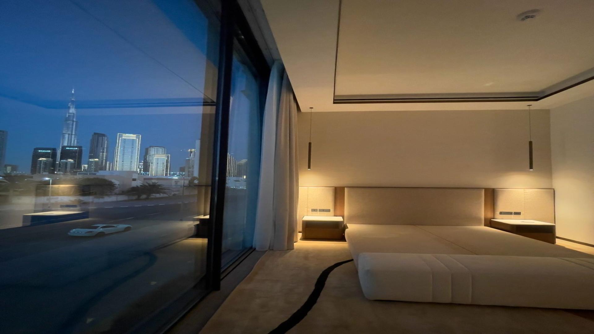 "Modern staircase in luxury villa, The Galleria Villas, Al Wasl, Burj Khalifa view.",Luxury villa bedroom with Burj Khalifa view, Al Wasl, The Galleria Villas, for sale