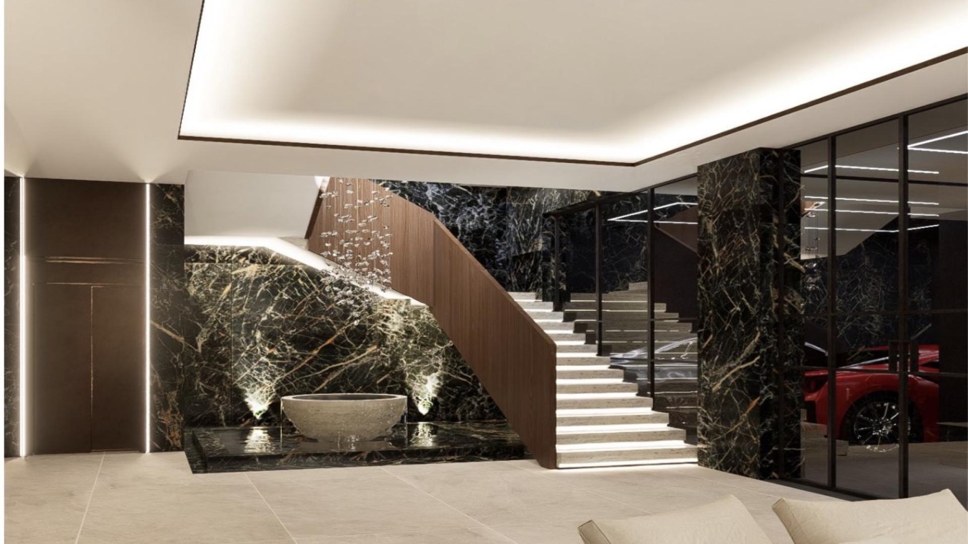 Interior of ultra luxury villa in Al Wasl, featuring modern staircase and indoor tree