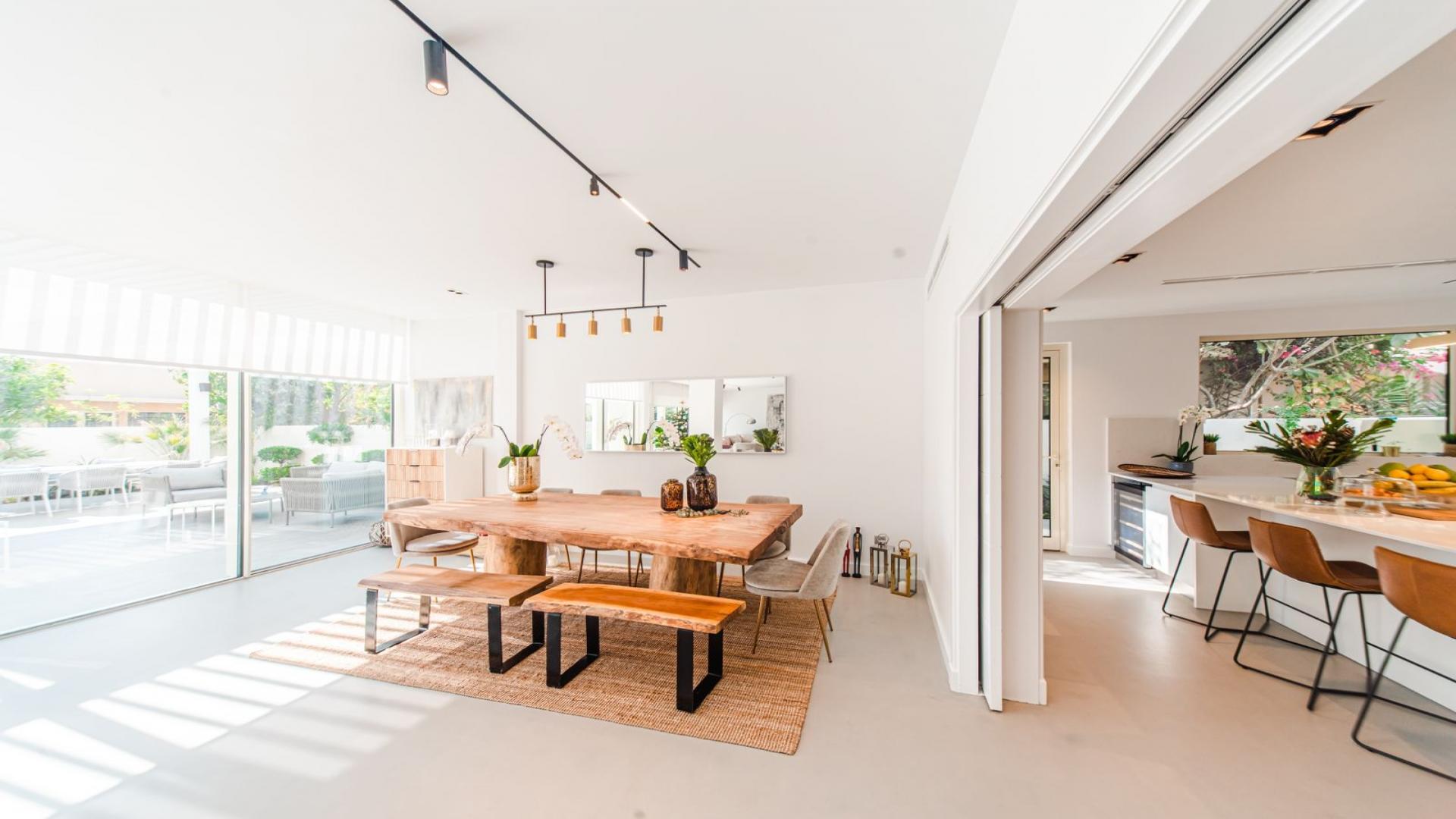 Upgraded villa living room with open plan layout in Saheel, Arabian Ranches