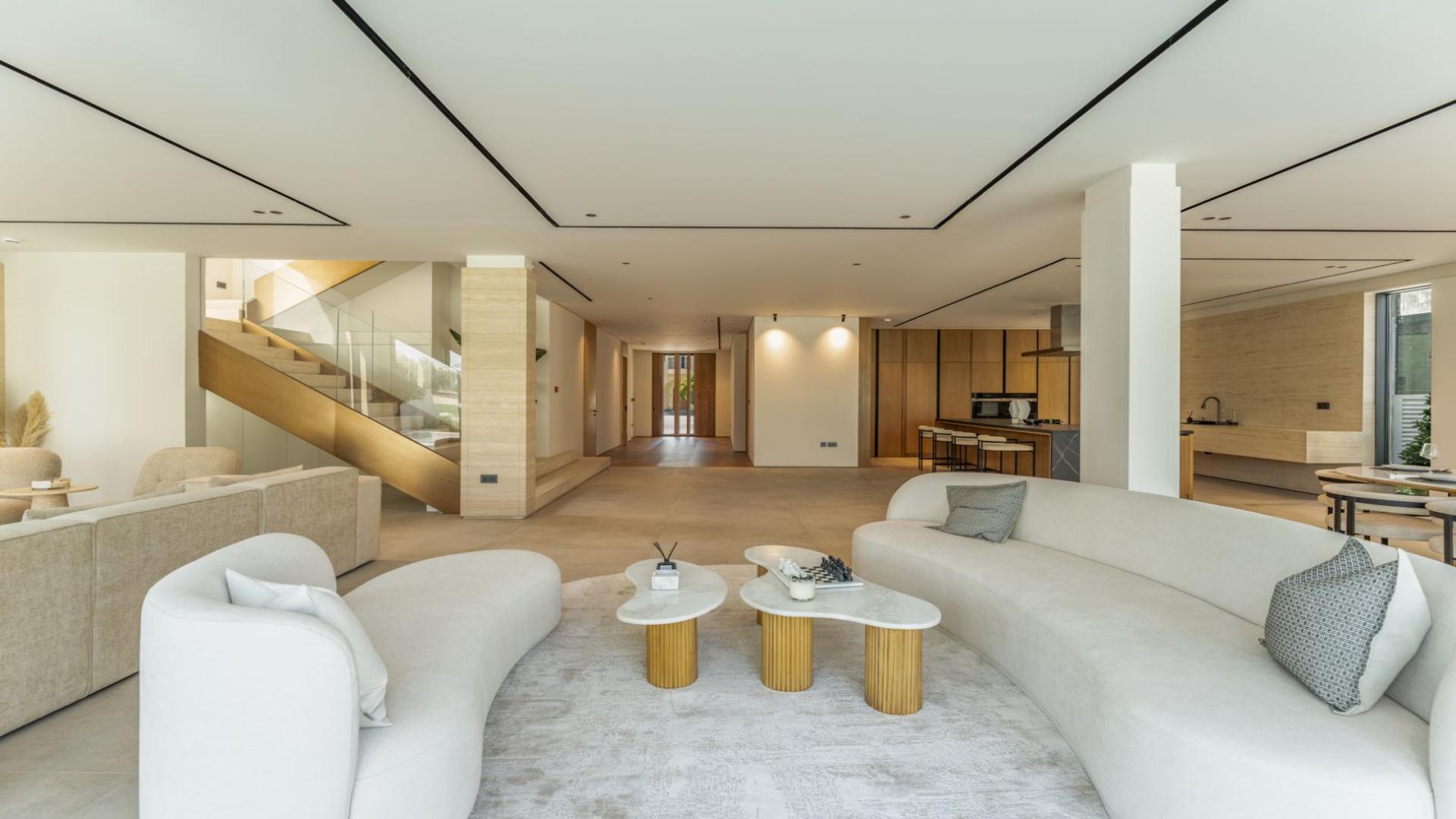 Modern patio and garden view of renovated villa at Jumeirah Golf Estates, Earth community