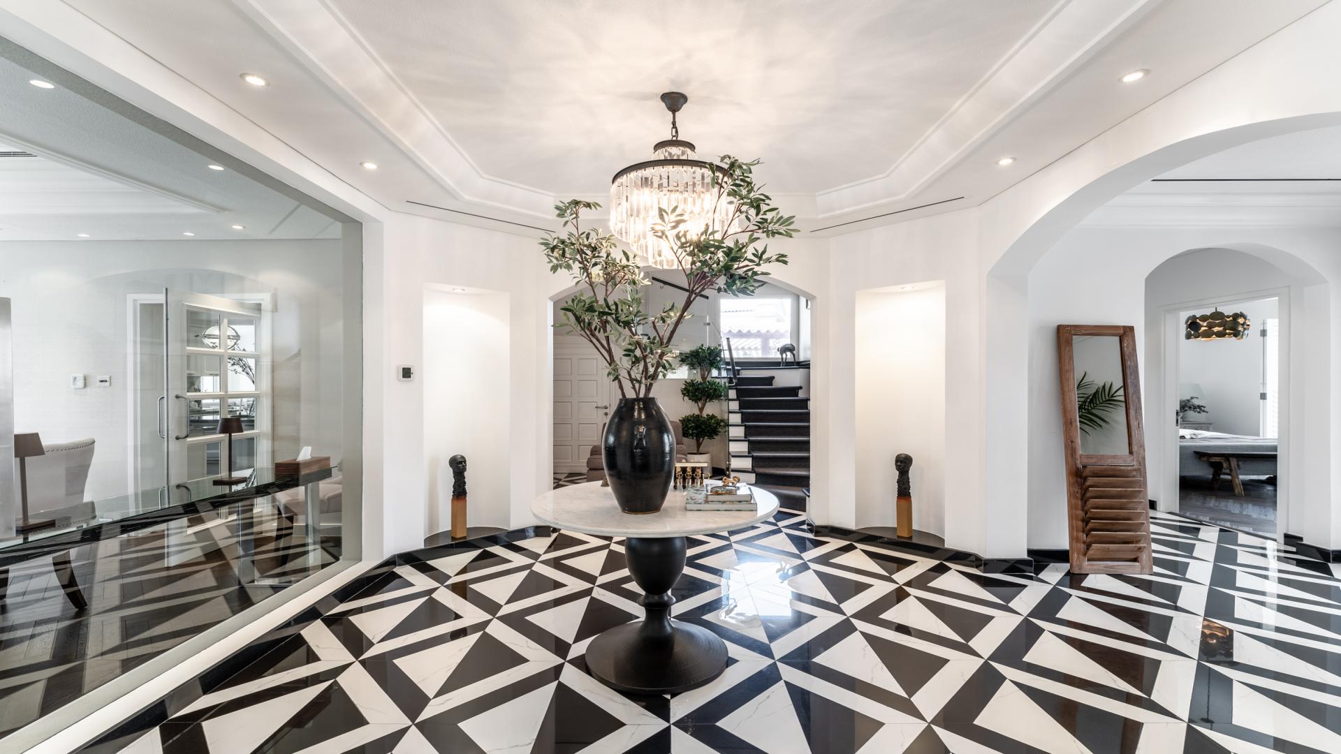 Modern living room in remodelled villa, Green Community West, featuring elegant decor and fireplace