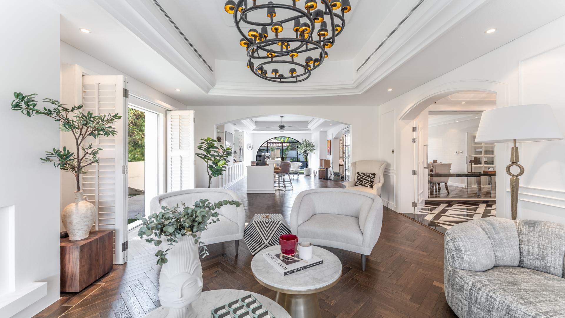 Luxurious living room in remodeled villa, Green Community West, featuring elegant decor and garden view