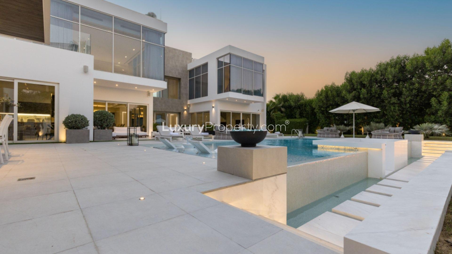 Stunning modern villa exterior with pool and garden in Al Wasl, Um Suquiem