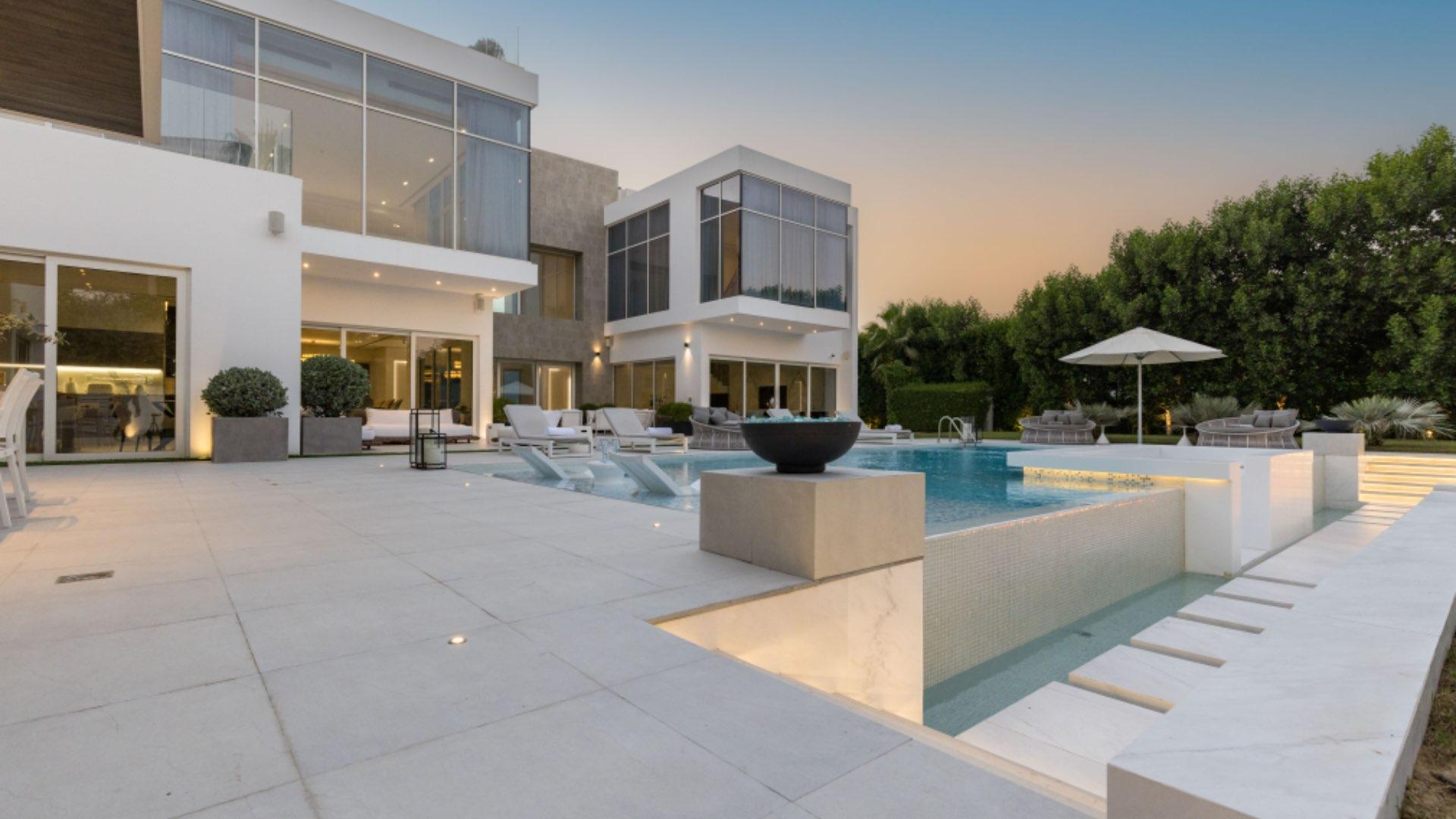 Stunning modern villa exterior with pool and garden in Al Wasl, Um Suquiem