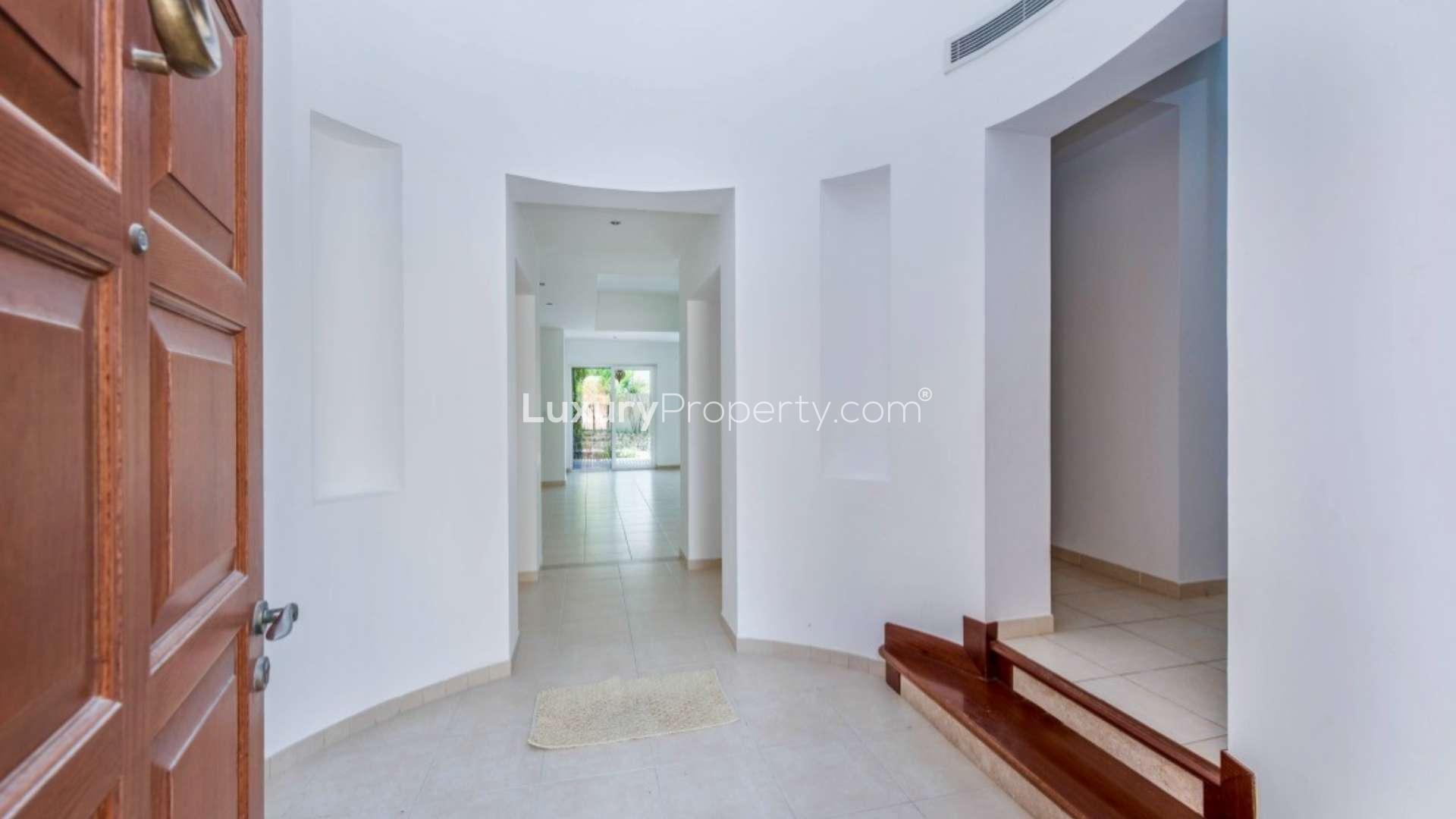 Empty room with large window and balcony view in Alvorada villa, Arabian Ranches