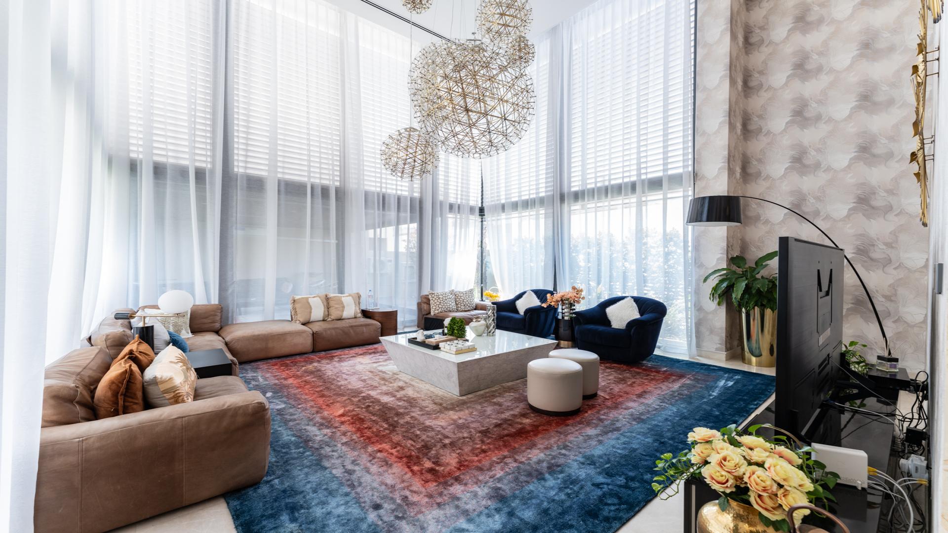 Modern 5-bedroom villa exterior with lawn in Sobha Hartland, MBR City, for sale