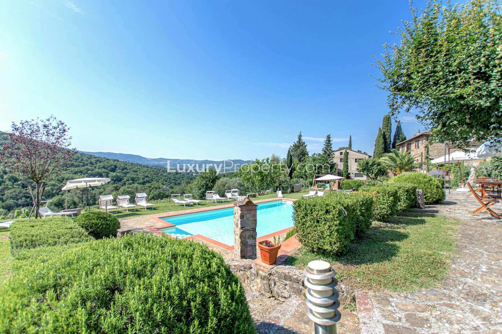 Classical Chianti villa with garden, stone facade, and stunning countryside views for sale