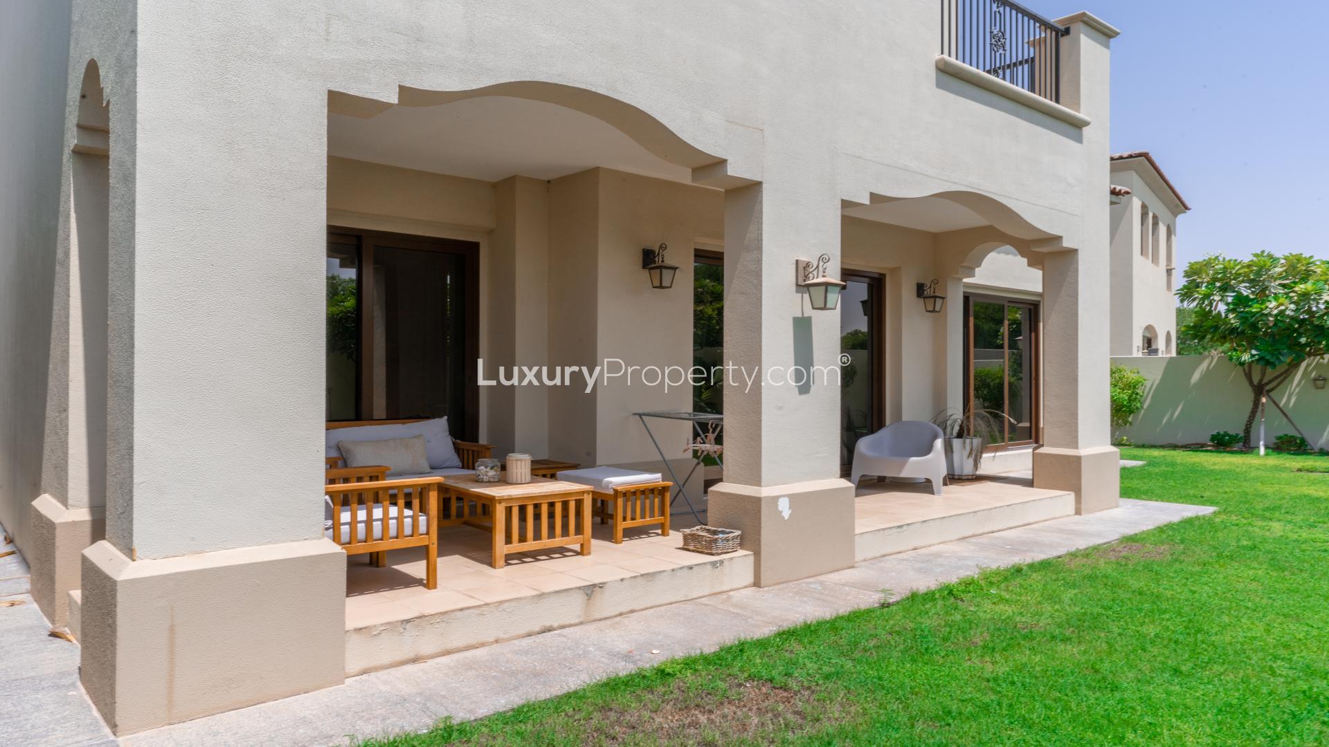 Immaculate villa exterior with lush garden in Arabian Ranches, Aseel community