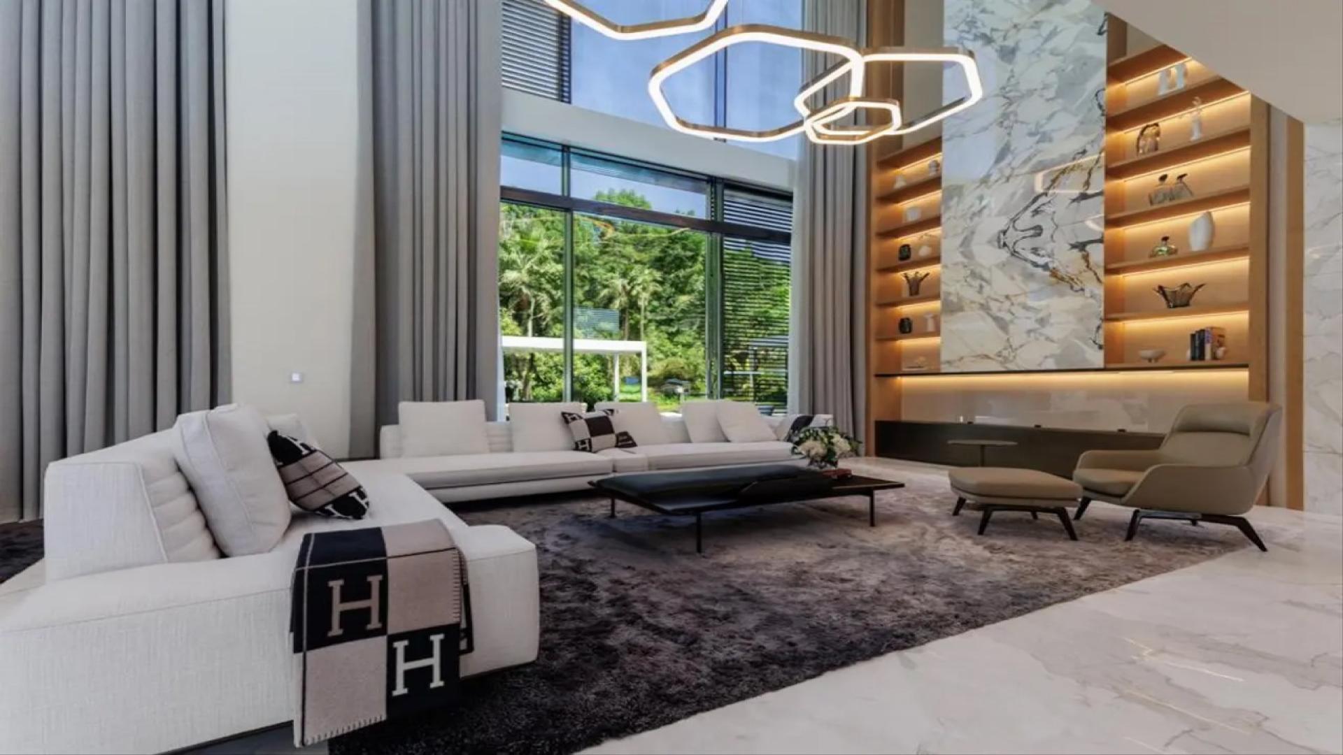 Ultra luxury Al Barari mansion exterior with driveway and lush landscaping, The Nest villa