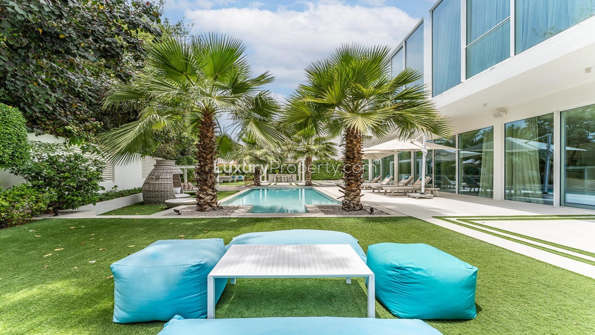 Luxury villa exterior with pool and patio in The Nest, Al Barari, Dubai