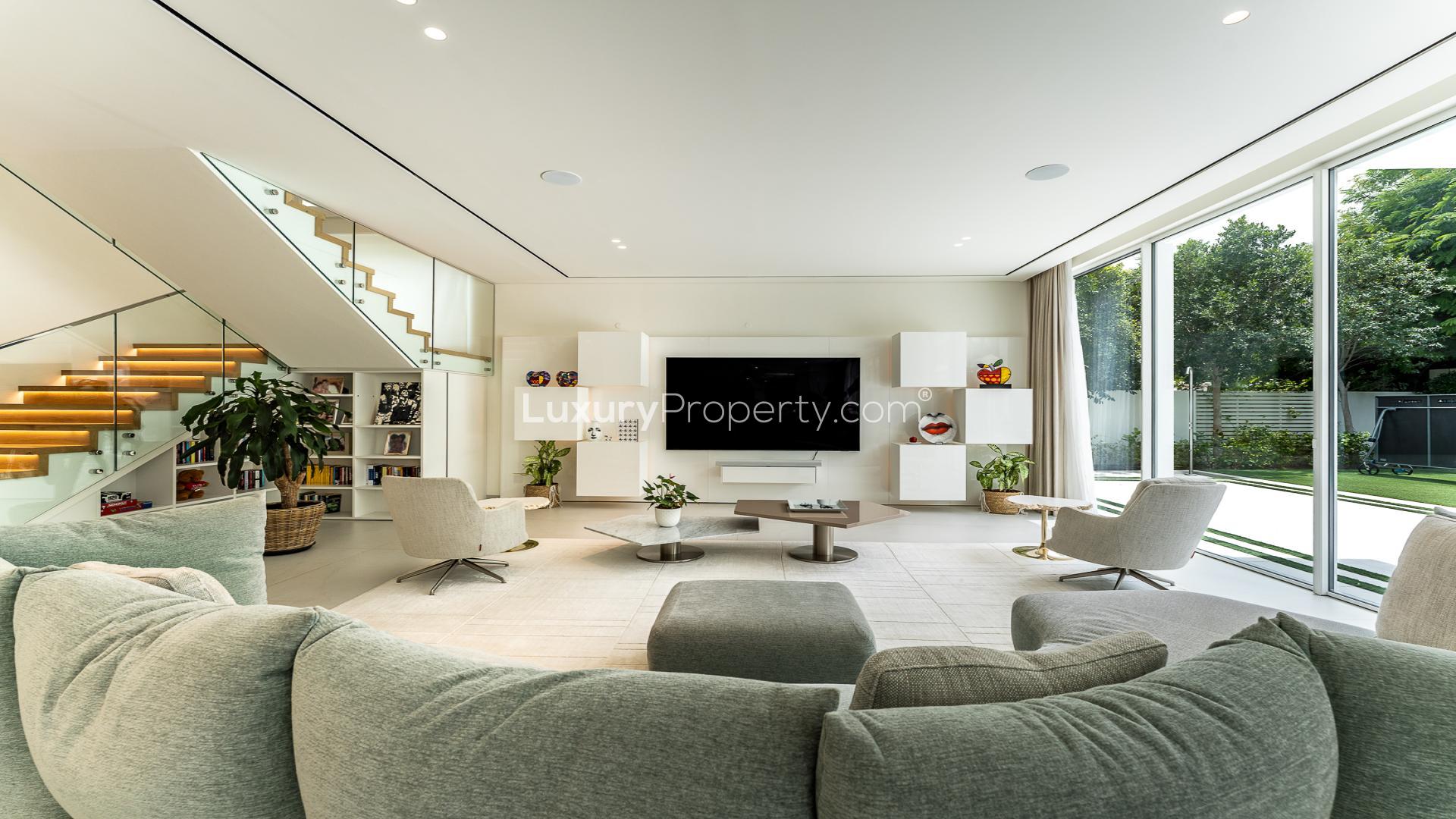 Luxurious living room in 5-bedroom villa at The Nest, Al Barari, featuring modern decor