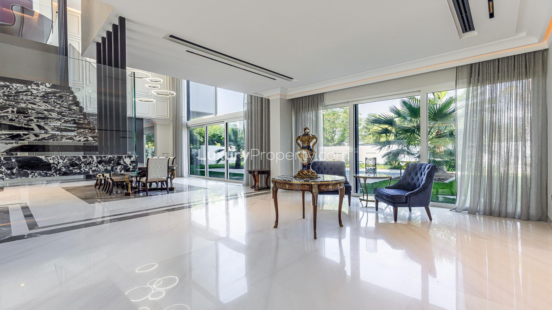 Spacious balcony view of lush garden and pool in Al Barari Nest Villa