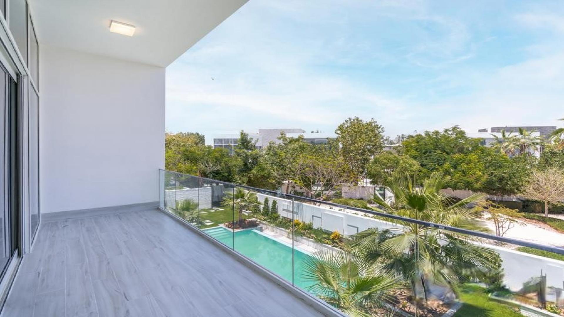 Luxurious dining area in fully upgraded Nest Villa, Al Barari, with garden view