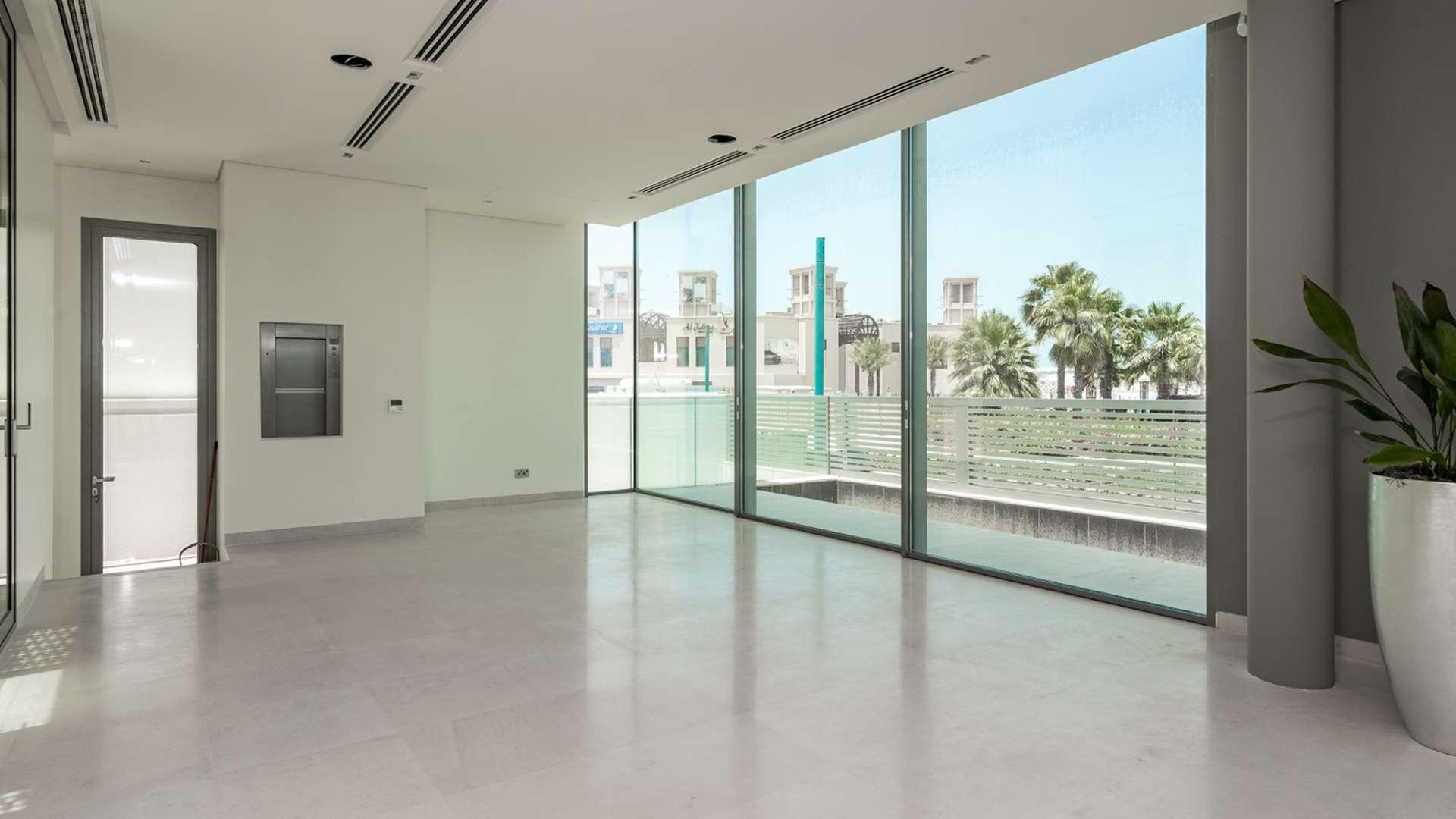 Luxury beachfront villa entrance in Jumeirah, featuring modern architecture and elegant design