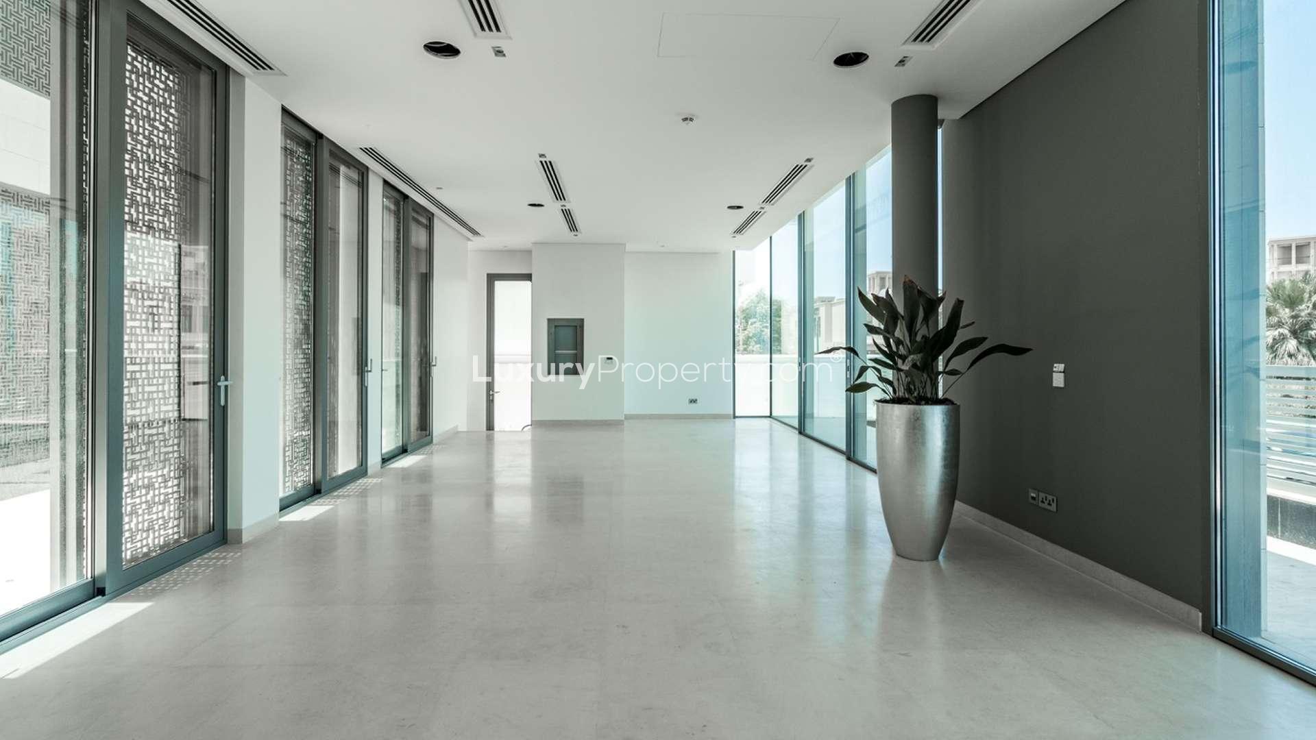 Luxury Jumeirah villa interior with large windows and palm tree views, Umm Suqeim