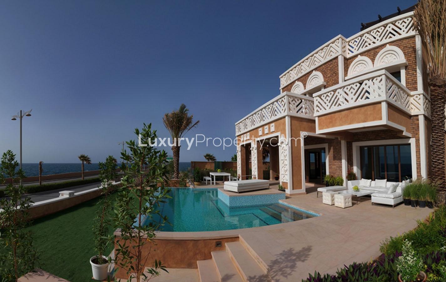 Luxurious outdoor patio and pool with ocean view at Palm Jumeirah villa, Dubai