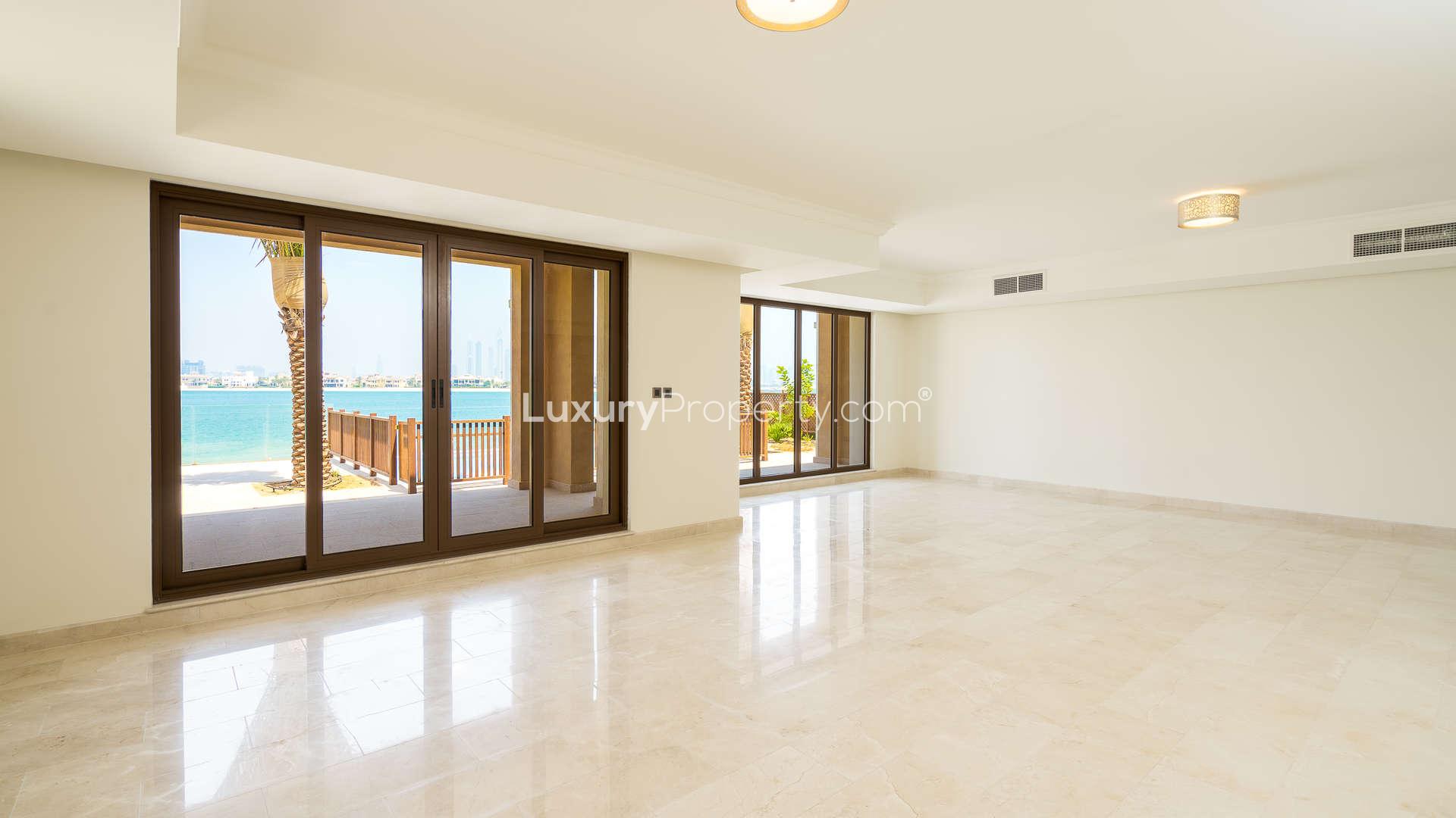 Spacious living room with ocean view in Palm Jumeirah beachfront villa for sale