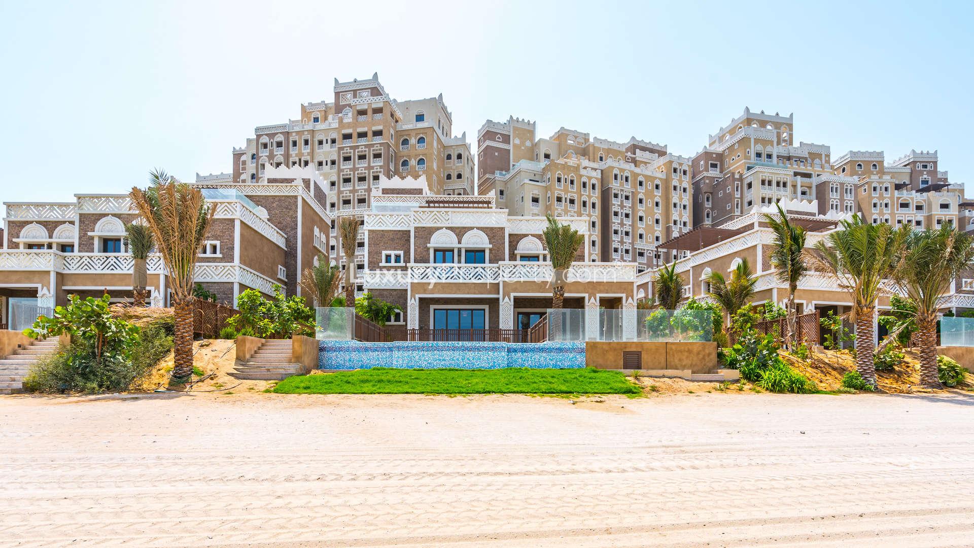 "Luxurious Palm Jumeirah villa terrace with stunning beachfront and skyline views for sale.",Beachfront villa in Kingdom of Sheba, Palm Jumeirah, for sale. Stunning architecture and views
