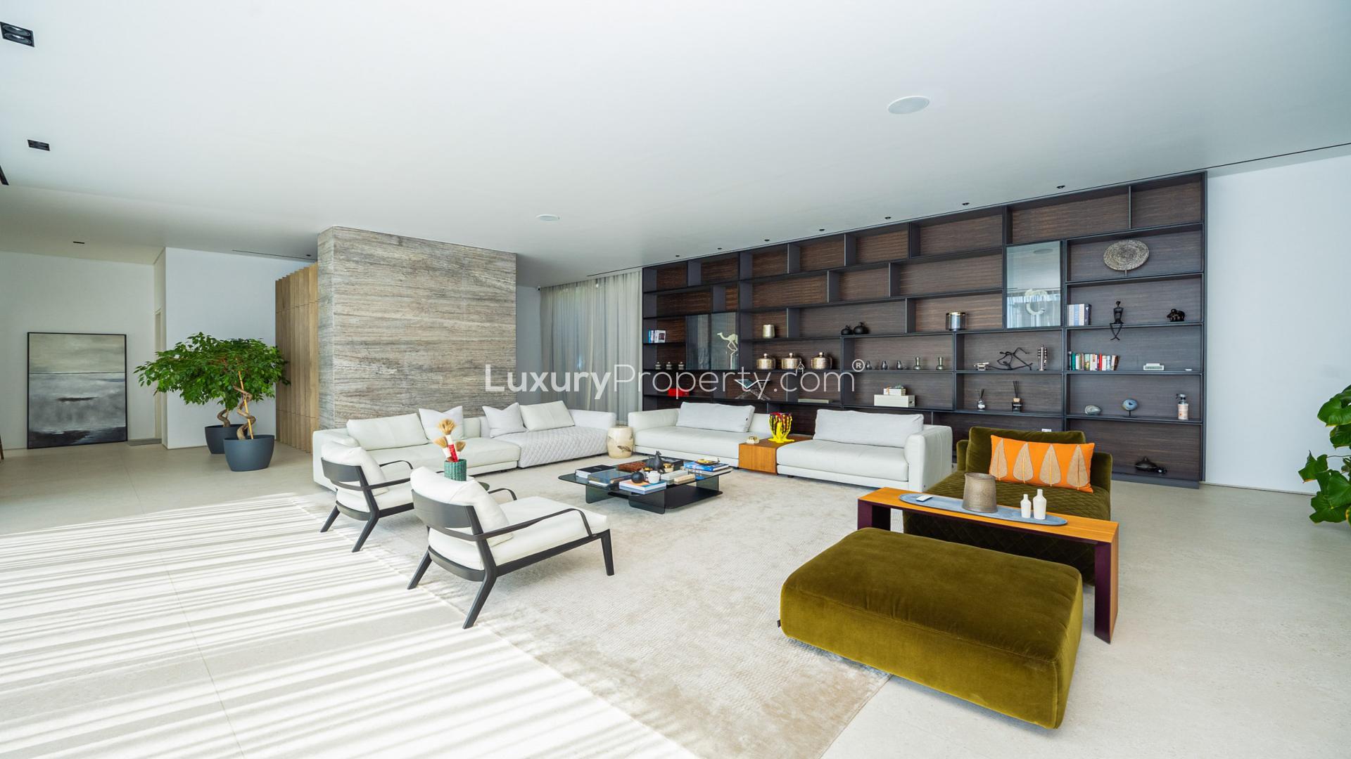 Pearl Jumeirah villa with pool, modern design, lush greenery, and spacious outdoor area