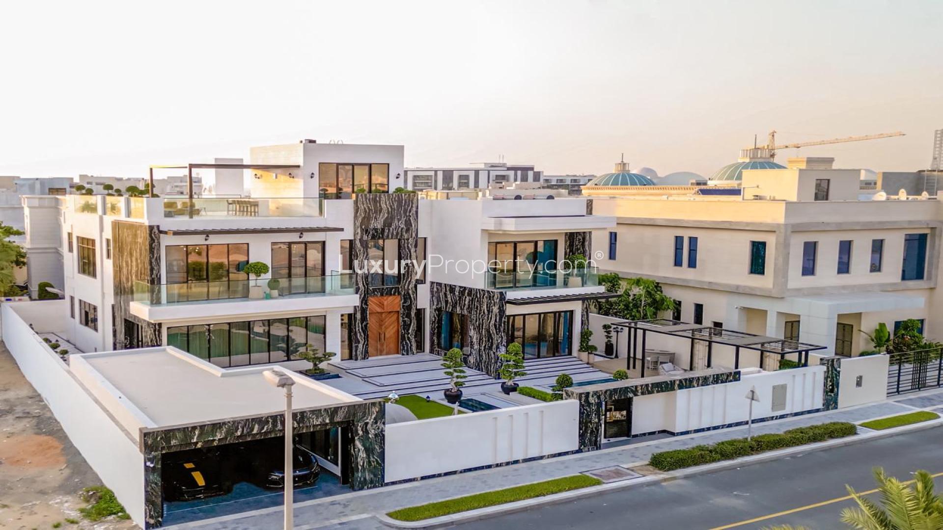Modern villa exterior with elegant design, lush garden, and spacious patio in Pearl Jumeirah